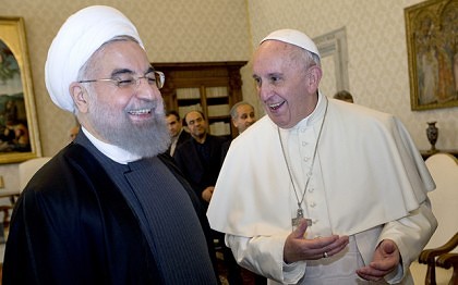 Pope Francis and Iranian President Hassan Rouhani, left, share a laugh during their private audience at the Vatican,Tuesday, Jan. 26, 2016. Iranís president has paid a call on Pope Francis at the Vatican during a European visit aimed at positioning Tehran as a potential top player in efforts to resolve Middle East conflicts, including Syriaís civil war. (AP Photo/Andrew Medichini, Pool)